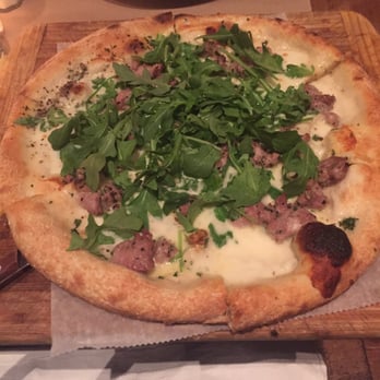 Malaparte - Pizza special of the day with crumbled sausage and arugula - Italian Near Me - New York, New York Malaparte - Pizza special of the day with crumbled sausage and arugula - Italian Near Me - New York, New York