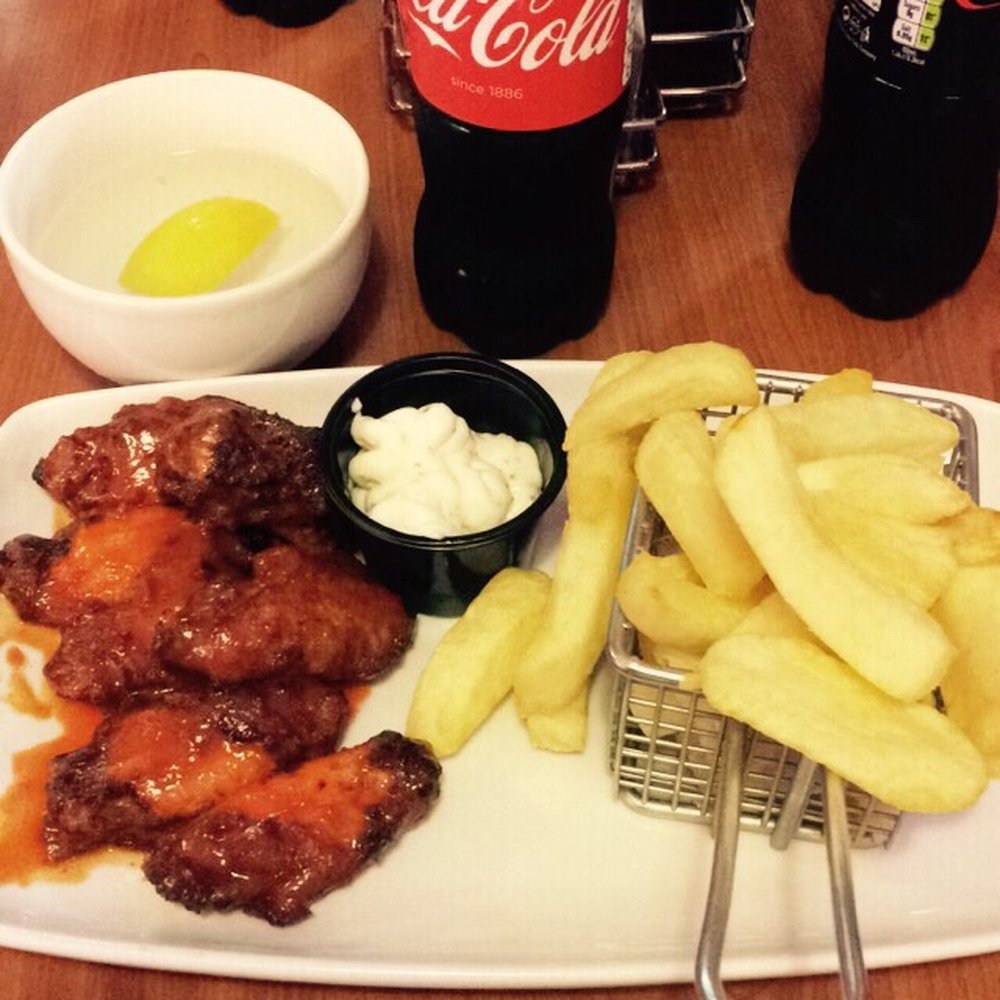 Kelstar Chippy - Half bucket of Frank's hot wings with a side of chips and a good old trusty bottle of coke - Fast Food Near Me - Belfast, BFS Kelstar Chippy - Half bucket of Frank's hot wings with a side of chips and a good old trusty bottle of coke - Fast Food Near Me - Belfast, BFS