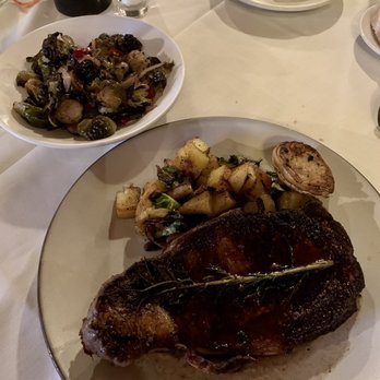 Rainbow Lodge - Great Hand Cut 16 oz 44 Farms Beef Ribeye Steak and Spicy Roasted Brussels Sprouts with Garlic and Calabrian Chilies - New American Near Me - Houston, Texas