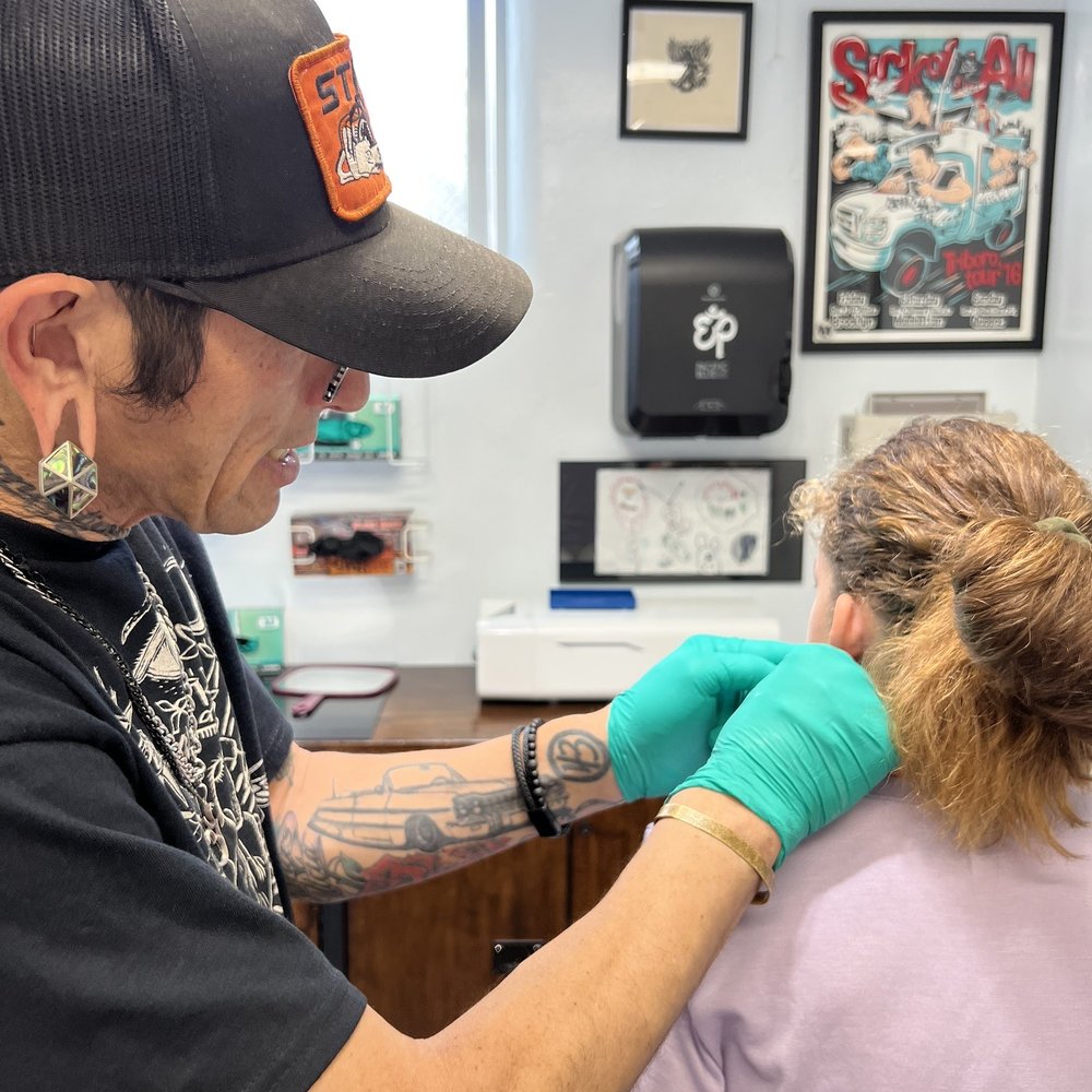 Metal & Stone - Eddie marking the ears. - Piercing Near Me - San Diego, California Metal & Stone - Eddie marking the ears. - Piercing Near Me - San Diego, California