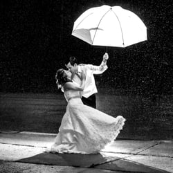 Ron McKinney Photography - Around 11PM on our wedding night, Ron asked for a few minutes during our reception and dancing, to take this shot in the rain.