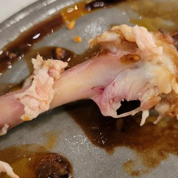 Otium Grill and Greens - Drumstick wasn't fully cooked through with gummy pink membrane - Bars Near Me - Seattle, Washington