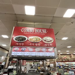 Restaurant name sign with all the food orders around this signage.