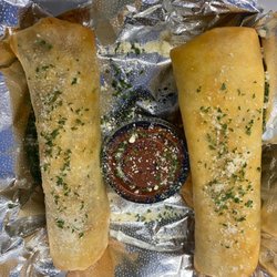 The M15 Snack Shack - Punks Pizza Rolls! Home Made Marinara, Pepperoni, Mozzerella Cheese, Red Pepper Flakes - Deep fried in 12" Tortilla.