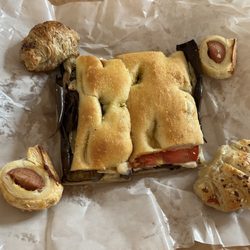 Forno Becagli - Eggplant focaccia. Sausage roll bites and stuffed cheese bites.