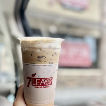 7 Leaves Cafe - Duluth - a hand holding a cup of iced coffee - Coffee & Tea Near Me - Duluth, Georgia 7 Leaves Cafe - Duluth - a hand holding a cup of iced coffee - Coffee & Tea Near Me - Duluth, Georgia