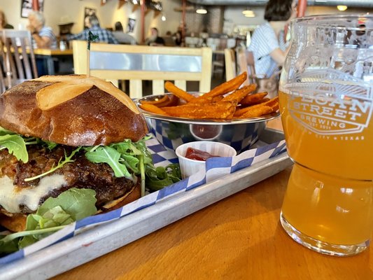 Photo of Pecan Street Brewing - Johnson City, TX, US. Pretzel jam burger with sweet potato fries