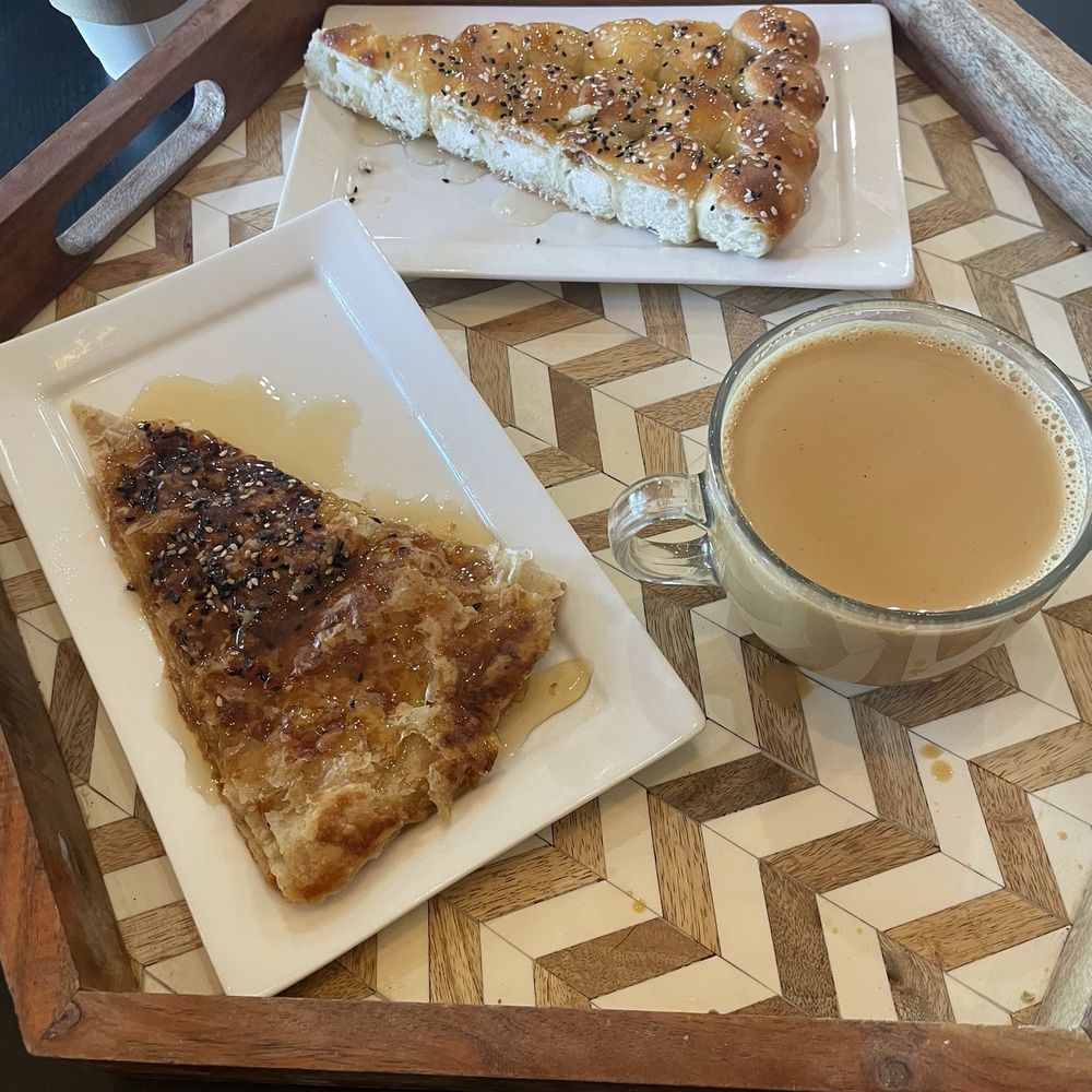 Mokha Cafe - Honeycomb bread needs to be warmed, adeni tea was so good! Forgot the named the other pastry. Good, but I needed a real knife to cut it. - Coffee & Tea Near Me - Bakersfield, California Mokha Cafe - Honeycomb bread needs to be warmed, adeni tea was so good! Forgot the named the other pastry. Good, but I needed a real knife to cut it. - Coffee & Tea Near Me - Bakersfield, California