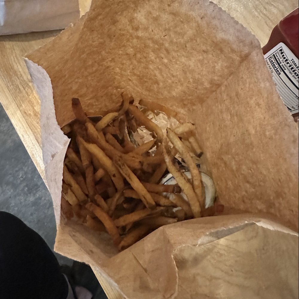 Burger and fries, all packed up to go Burger and fries, all packed up to go