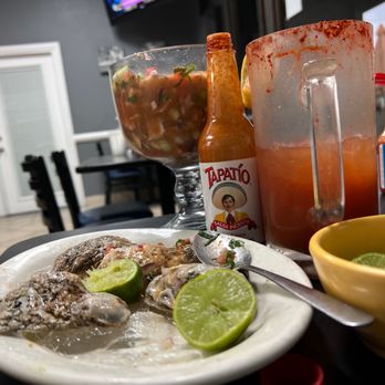 Mariscos Mocorito - a plate of oysters and a bowl of salsa - Mexican Near Me - Orange, California Mariscos Mocorito - a plate of oysters and a bowl of salsa - Mexican Near Me - Orange, California