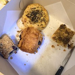 Za'atar focaccia, bialys focaccia, chocolate croissant, blueberry coffee cake