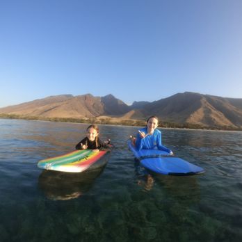 Swell Maui Surf Lessons - Eight and twelve years old starting their first surfing lesson. - Surf Schools Near Me