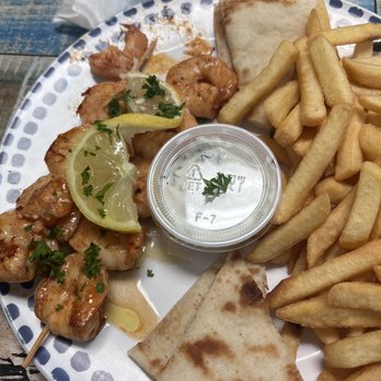 Greek House Kitchen - Shrimp Souvlaki Plate. Shrimps, fries and French Fries. Served with greek salad. Delicious. - Greek Near Me - Palmetto Bay, Florida Greek House Kitchen - Shrimp Souvlaki Plate. Shrimps, fries and French Fries. Served with greek salad. Delicious. - Greek Near Me - Palmetto Bay, Florida