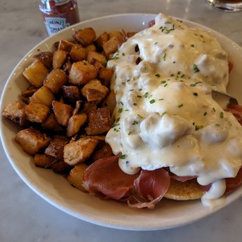 Pop's For Italian - Prosciutto Benedetto with sausage gravy and crispy country fries. - Italian Near Me - Ferndale, Michigan