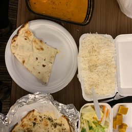 Butter chicken , rice and garlic nan. Butter chicken , rice and garlic nan.