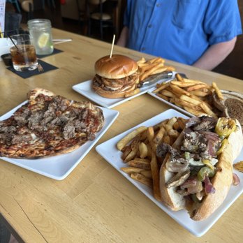 Brick’s Downtown Bar & Grill - Meatzza flatbread, the Brix & Mortar gourmet hamburger, the Steak Bomb on a Demi-baguette, and the Patty Melt w scrumptious seasoned fries. - Sports Bars Near Me - Manitowoc, Wisconsin
