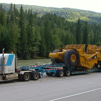 Logi Transports - 8 axle RGN with stinger hauling a scraper. Very heavy equipment :) - Vehicle Shipping Near Me - Sebastian, Florida