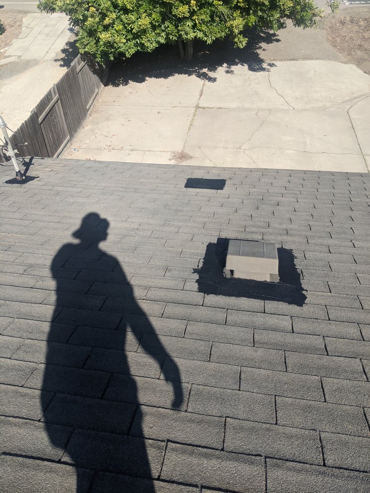 Slide of Tom's Roofing Services