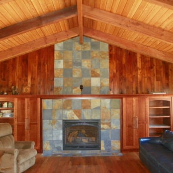 Tall Tree Remodeling - a living room with a fireplace - General Contractors Near Me Tall Tree Remodeling - a living room with a fireplace - General Contractors Near Me