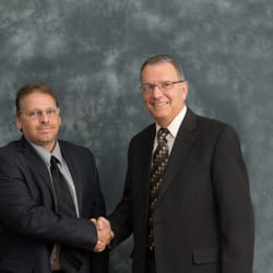 Morris Knowles & Associates - President Jim Bollibon on right congratulation VP Bill Utzman