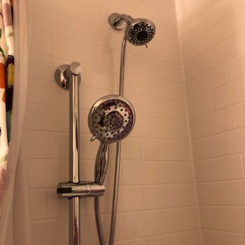 Newpro Home Improvement Solutions - The now satisfactory fixed head and the hated hand held shower. I don't know if you can see the weak water flow in this shot. - Windows Installation Near Me - Woburn, Massachusetts Newpro Home Improvement Solutions - The now satisfactory fixed head and the hated hand held shower. I don't know if you can see the weak water flow in this shot. - Windows Installation Near Me - Woburn, Massachusetts