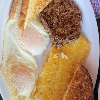 Penelope's Lil Cafe - Eggs made over easy with extra crispy hash, hamburger patty and wheat toast - American Near Me - Lincoln, Nebraska