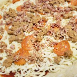 Festival Foods - The take and bake meat lovers pizza up close before baking
