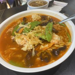 Spicy Seafood Noodle. Lots of shrimp , cuttlefish, mussels and vegetables