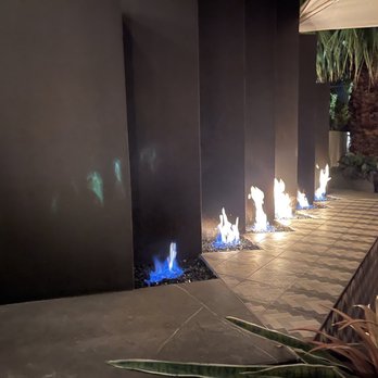 Mr. Lyons - Beautiful fireplace by the outdoor seating. - Steakhouses Near Me - Palm Springs, California Mr. Lyons - Beautiful fireplace by the outdoor seating. - Steakhouses Near Me - Palm Springs, California