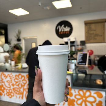 Virtu Coffee - a person holding a cup of coffee - Cafes Near Me - Los Angeles, California Virtu Coffee - a person holding a cup of coffee - Cafes Near Me - Los Angeles, California