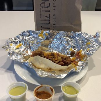 Cruzteca Mexican Kitchen - Yo Primero Breakfast Taco To Go- bacon, potatoes, caramelized onions, cheddar - Breakfast & Brunch Near Me - Austin, Texas Cruzteca Mexican Kitchen - Yo Primero Breakfast Taco To Go- bacon, potatoes, caramelized onions, cheddar - Breakfast & Brunch Near Me - Austin, Texas