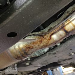 Burnt Mills Auto Body & Service - Showed a picture of oil leak in diagnosis of smell.