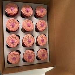 Standard size red velvet cupcakes with strawberry buttercream frosting