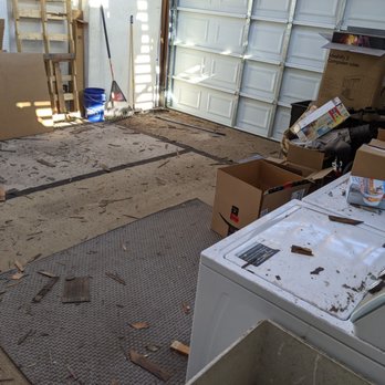 Vezina Industries - Type of mess in garage, not the worst but we would have covered the washer and dryer if known. Had to pull roof out of it. - Windows Installation Near Me - Madera, California