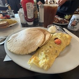 Make your own omelette (bacon, cheddar, tomato) and a short stack of chocolate chip pancakes. Make your own omelette (bacon, cheddar, tomato) and a short stack of chocolate chip pancakes.