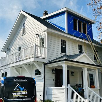 Ds Empire General Construction - a van parked in front of a house - Refinishing Services Near Me
