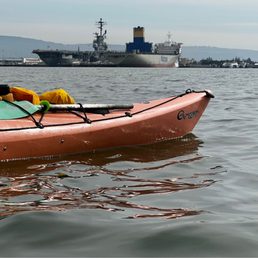 Aircraft carrier USS Hornet at the far center left. Joe's Kayak in the foreground, leading the tour. Aircraft carrier USS Hornet at the far center left. Joe's Kayak in the foreground, leading the tour.