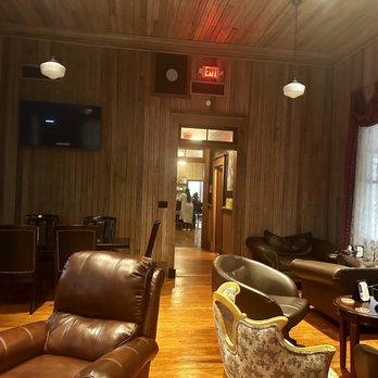 Docs Humidor - a living room with leather furniture - Lounges Near Me - Hartsville, South Carolina