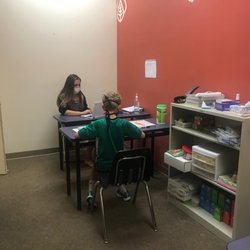 1:1 teaching with books and manipulatives