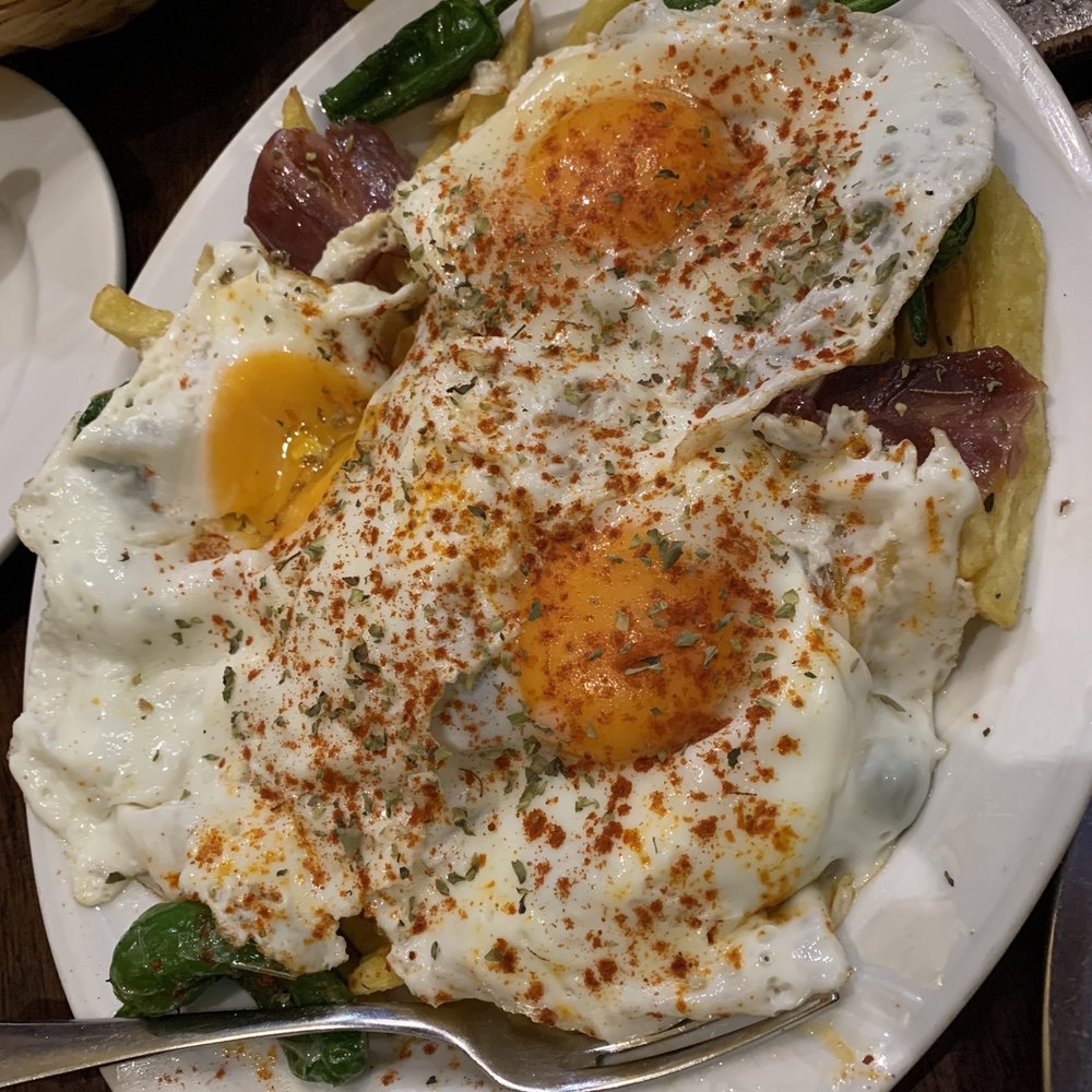 Malaspina - Potatoes (fries) with fried eggs and ham - Tapas Bars Near Me - Madrid, M Malaspina - Potatoes (fries) with fried eggs and ham - Tapas Bars Near Me - Madrid, M