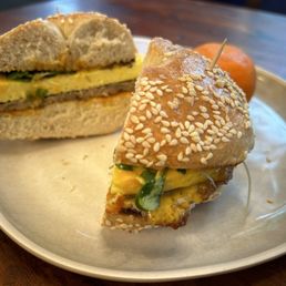Sausage and egg breakfast sandwich on sesame bagel.