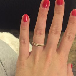 Two custom wedding bands made to hug my engagement ring. Two custom wedding bands made to hug my engagement ring.