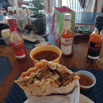 Tacos El Jerry - Birria Burrito with the Hot Drops sauces on deck - Food Trucks Near Me - Watsonville, California Tacos El Jerry - Birria Burrito with the Hot Drops sauces on deck - Food Trucks Near Me - Watsonville, California