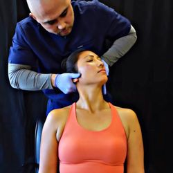 OPTMZ State - Seated and laying cervical adjustments provided