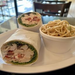 Tuscan Pita: chicken, mixed greens, tomatoes, feta cheese, bell peppers, pesto, and balsamic Tuscan Pita: chicken, mixed greens, tomatoes, feta cheese, bell peppers, pesto, and balsamic