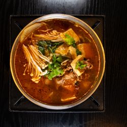 Myungin Dumplings - Malatang! Housemade beef broth with beef brisket, tofu, enoki mushroom, radish, cabbage, Sichuan peppercorns and topped with cilantro.