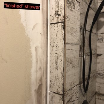 Baker Construction & Remodeling - same white grout (not brown as it should be) to try to hide the uneven cuts - General Contractors Near Me