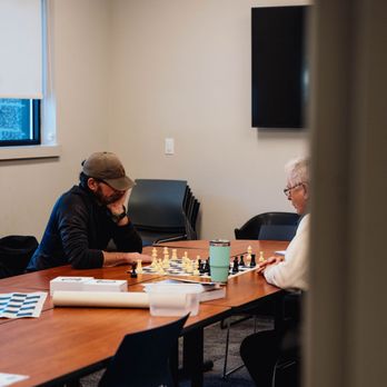 East Bonner County Library District - Adults practicing chess during the weekly chess club. - Libraries Near Me - Sandpoint, Idaho East Bonner County Library District - Adults practicing chess during the weekly chess club. - Libraries Near Me - Sandpoint, Idaho