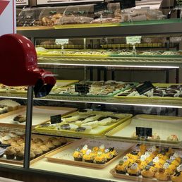 a variety of pastries in a display case