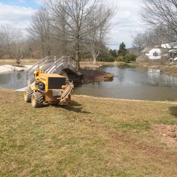 Wet Scape Irrigation - a tractor and a pond - Landscaping Near Me Wet Scape Irrigation - a tractor and a pond - Landscaping Near Me